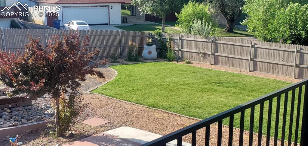 Image 37 of 41: View of fenced backyard