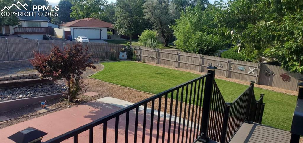 Image 38 of 41: Fenced backyard, View from deck off Kitchen
