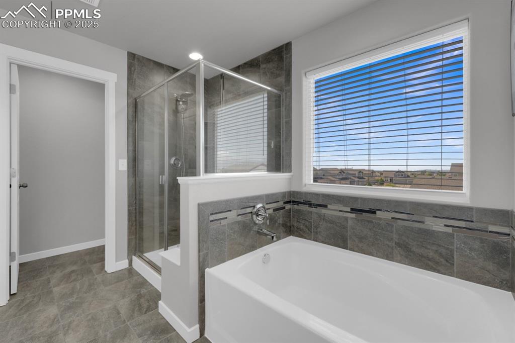 Image 16 of 40: Soak away the days stress in your master bathroom