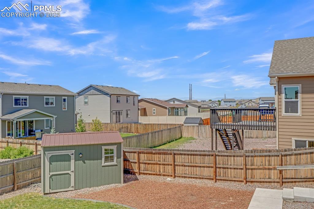 Image 29 of 40: Fenced backyard