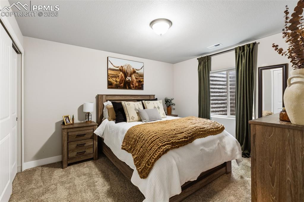 Image 28 of 41: Basement bedroom