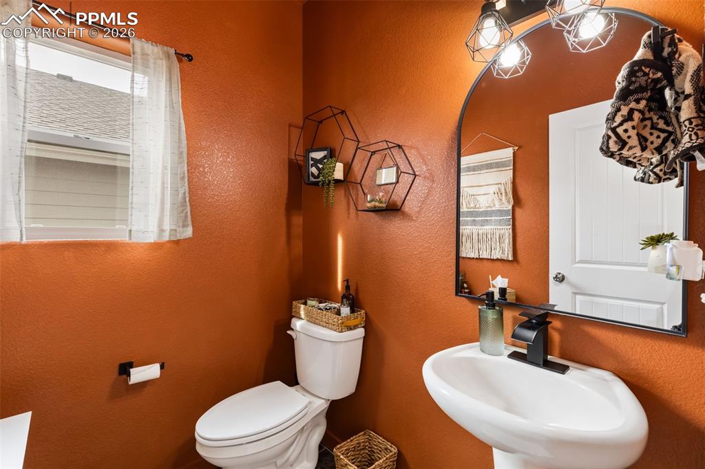 Image 31 of 41: Main level half bathroom