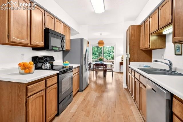 Image 10 of 32: Kitchen designed with plenty of cabinets for organization and convenience a