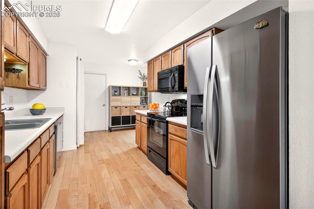Image 11 of 36: Spacious kitchen with double sinks.