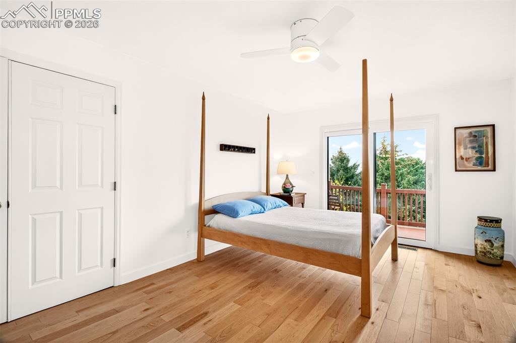Image 15 of 36: Enter the primary bedroom through french doors featuring those beautiful ma