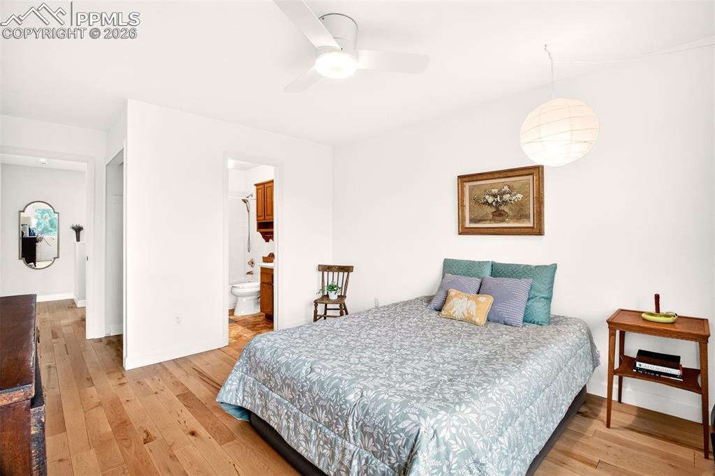 Image 21 of 32: Bedroom with an adjoining full bathroom.