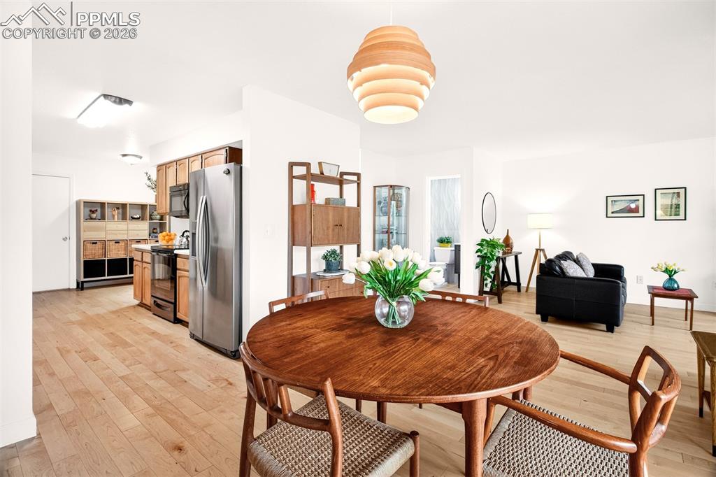 Image 8 of 32: Dining area with direct access to the kitchen.