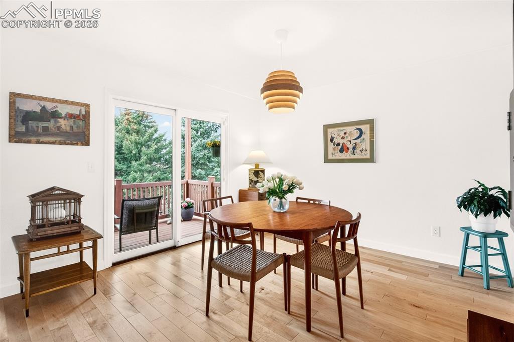 Image 9 of 36: Dining area featuring new sliding glass door providing easy access to the c