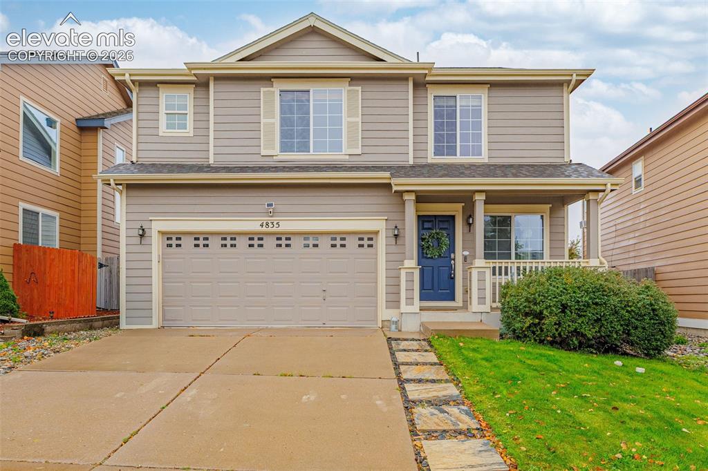 Image 1 of 35: Two-story exterior featuring lap siding, a front porch with column supports