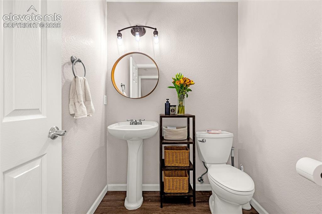 Image 15 of 35: Pedestal sink with polished chrome widespread faucet, round wall-mounted mi