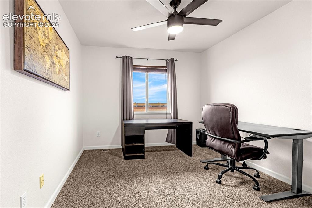 Image 26 of 35: Room featuring neutral-toned carpeting, a central ceiling fan with integrat