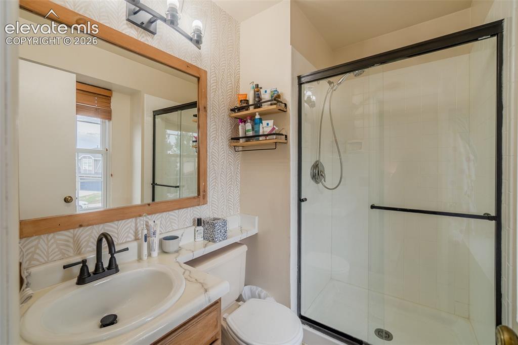 Image 14 of 31: Framed mirror with integrated lighting, single-basin vanity with a new sink