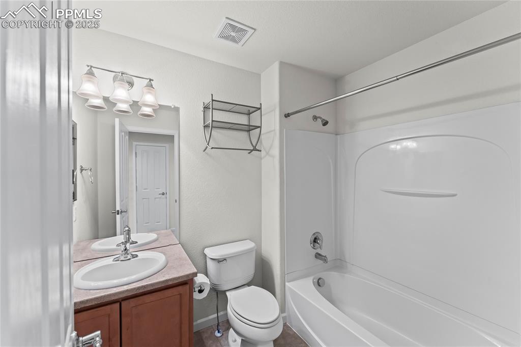 Image 15 of 26: Full bath with bathtub / shower combination and vanity