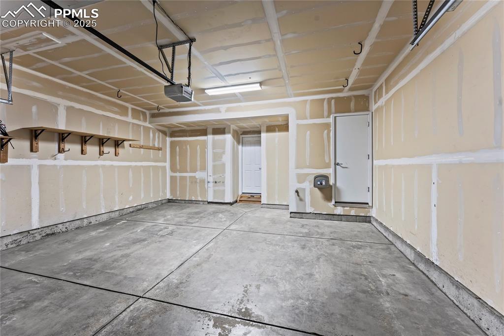 Image 24 of 26: Garage with a garage door opener