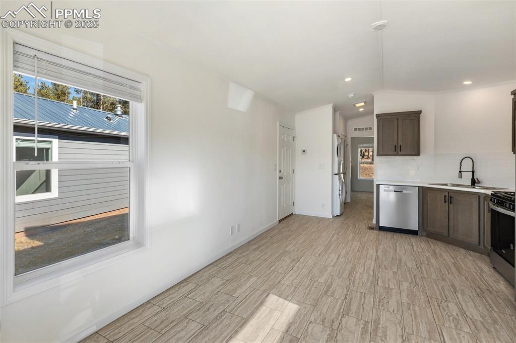 Image 7 of 23: Living Room and Kitchen