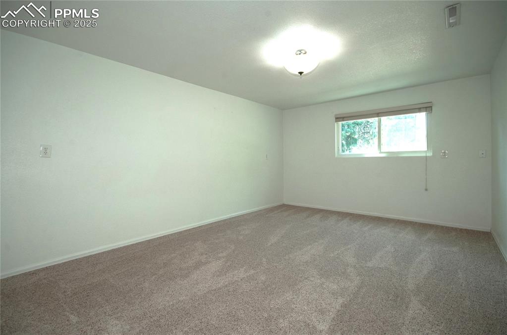 Image 19 of 42: Empty room featuring light carpet and baseboards