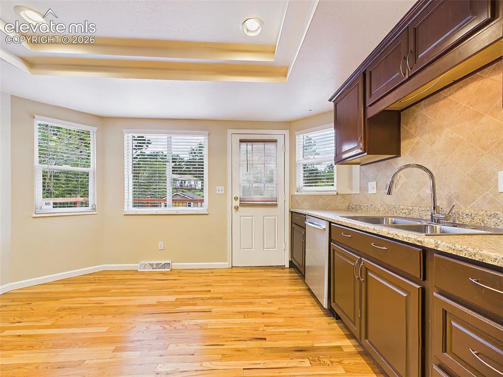 Image 13 of 50: Another view of the spacious eat-in kitchen showcasing ample cabinet storag