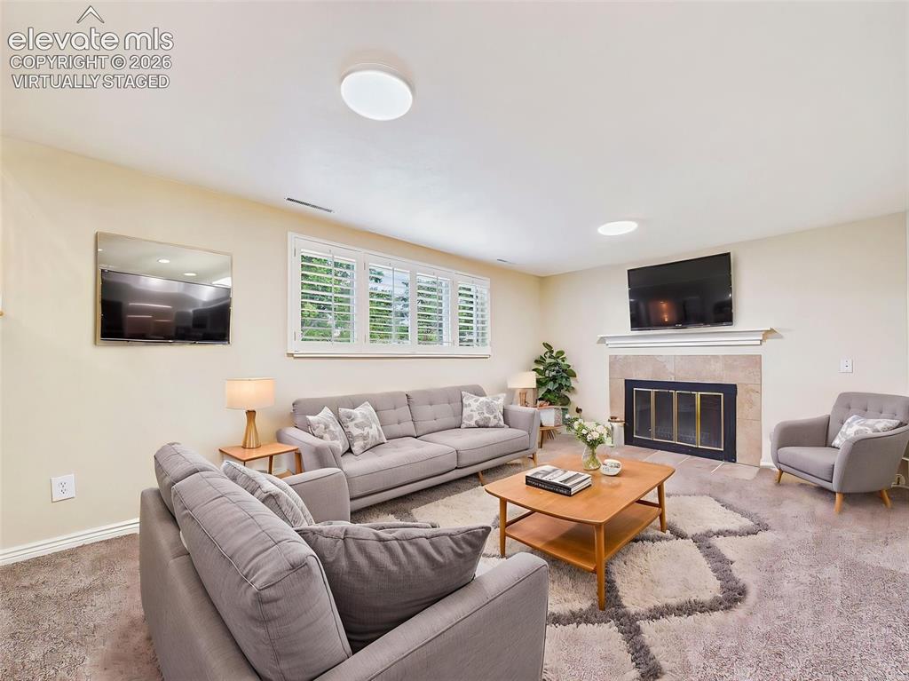 Image 31 of 50: (Virtually Staged) Family Room – Virtually staged to showcase the room’s ge
