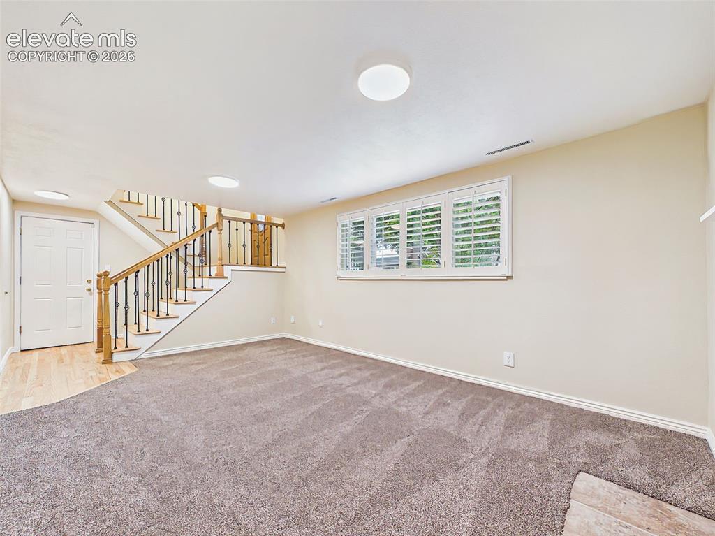 Image 35 of 50: Family Room – Unfurnished view emphasizes the spacious layout, large pictur
