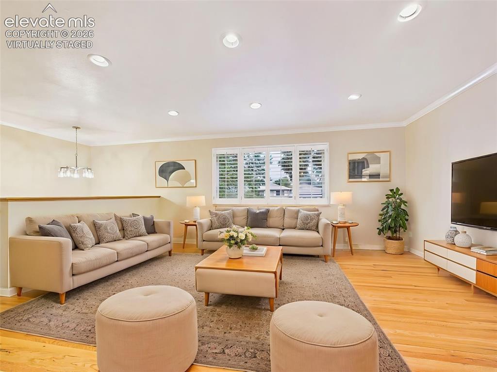 Image 4 of 50: (Virtually Staged) Living Room – Spacious living room filled with natural l