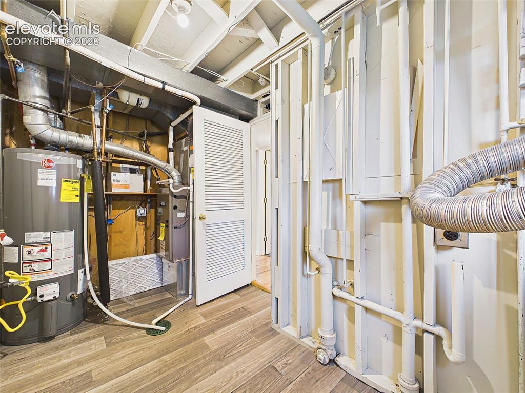Image 41 of 50: Dedicated utility room housing the mechanical systems, offering easy access
