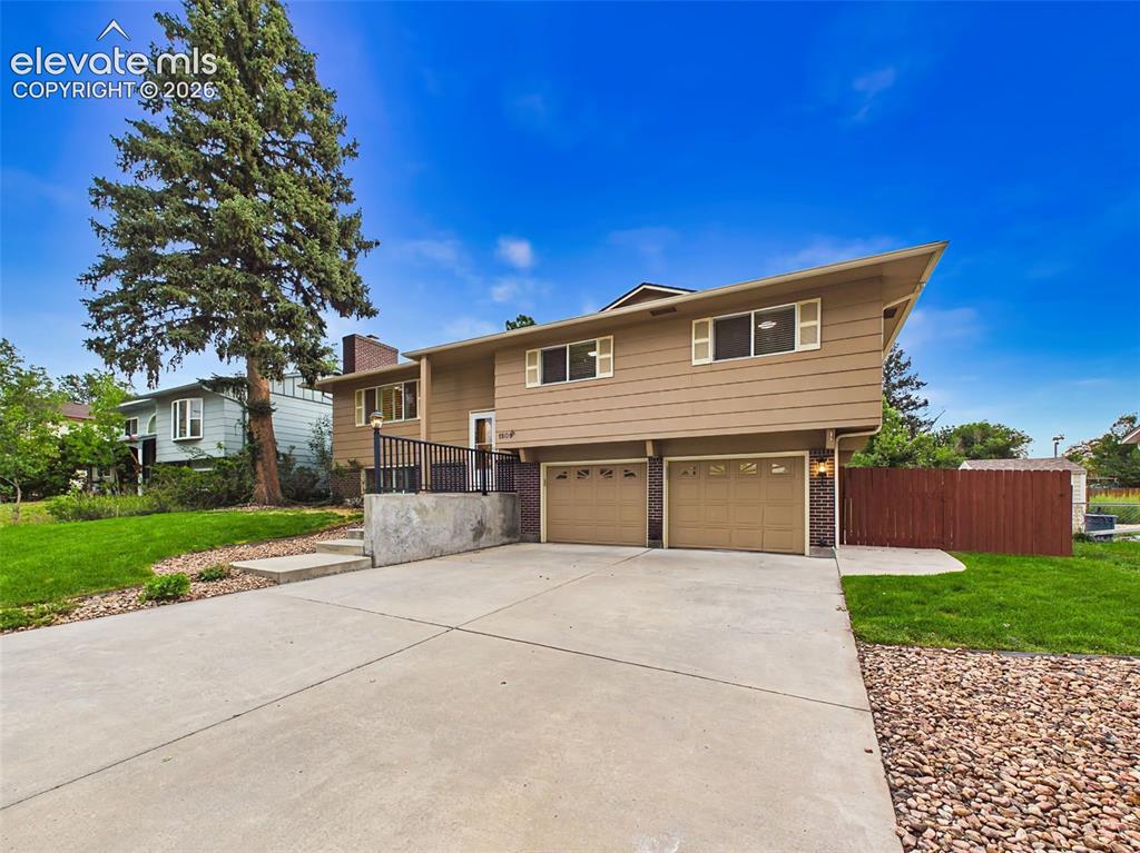 Image 42 of 50: Well-maintained split-level home featuring attractive curb appeal, an overs