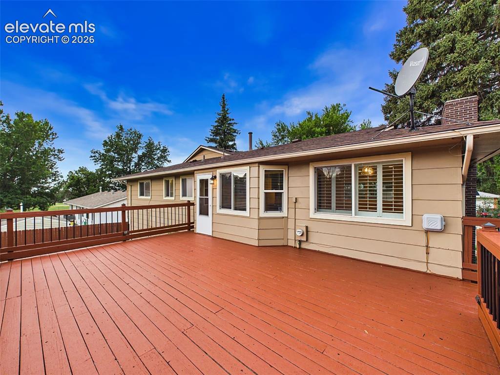 Image 45 of 50: Large elevated deck provides the perfect setting for outdoor dining, entert