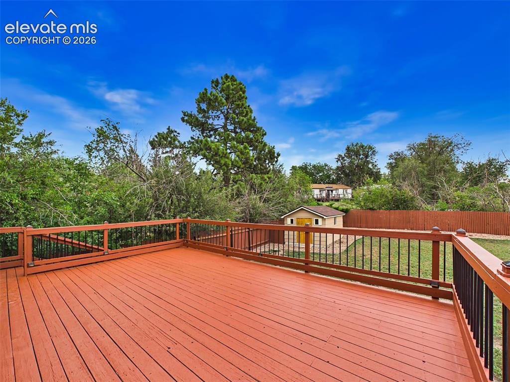 Image 47 of 50: Expansive deck offers plenty of space for gatherings while enjoying views o
