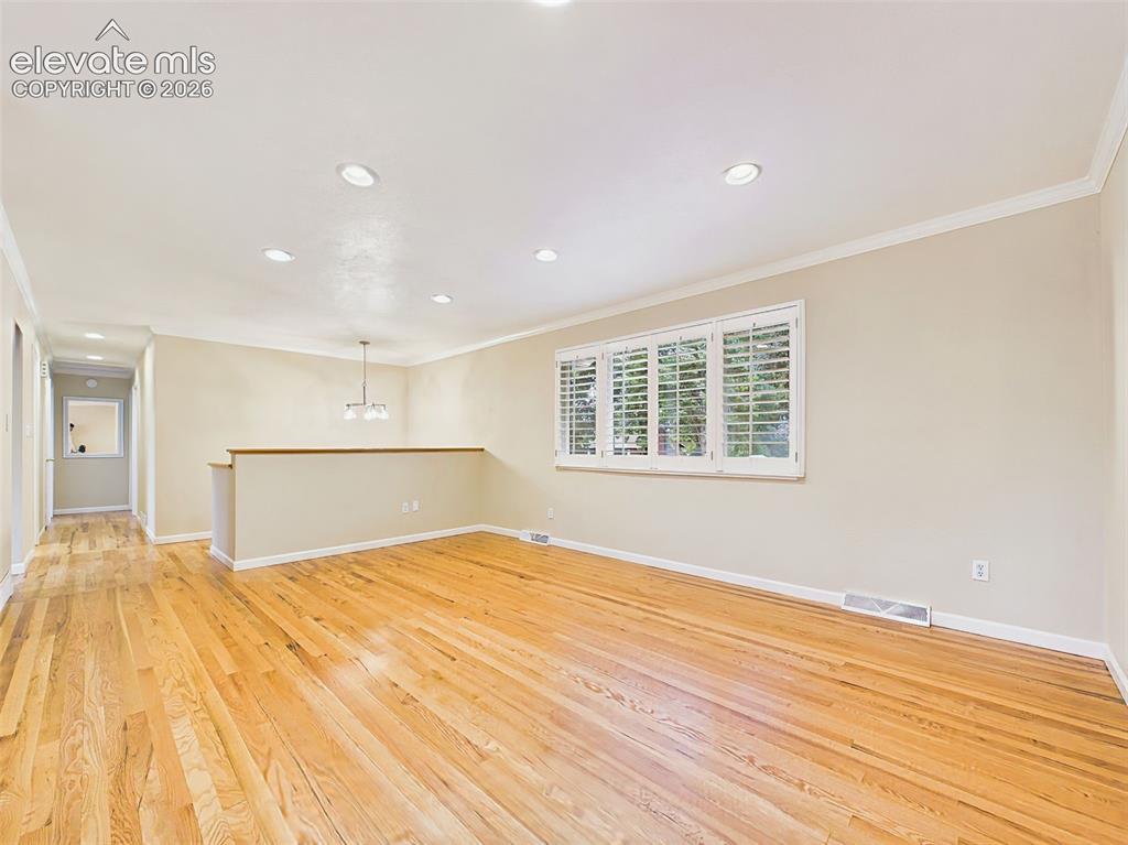 Image 7 of 50: Living Room – Another view of the living room highlights its spacious layou