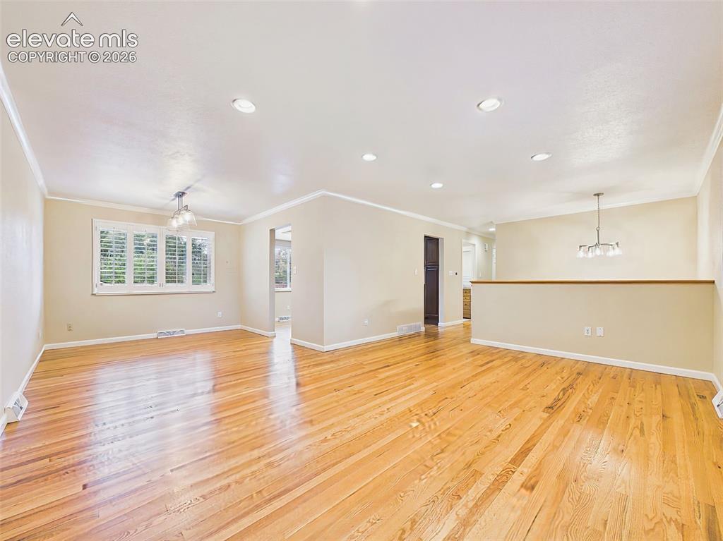 Image 9 of 50: Living & Dining Areas – A wide view showcases the home