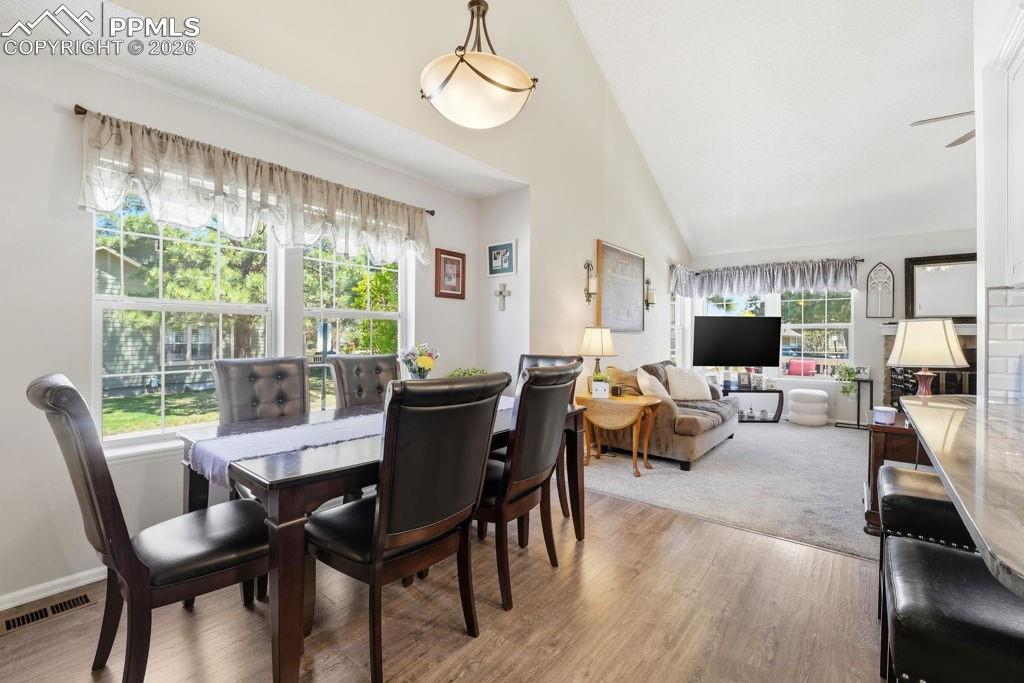 Image 15 of 41: Dining area featuring wood-finish flooring and dual windows
