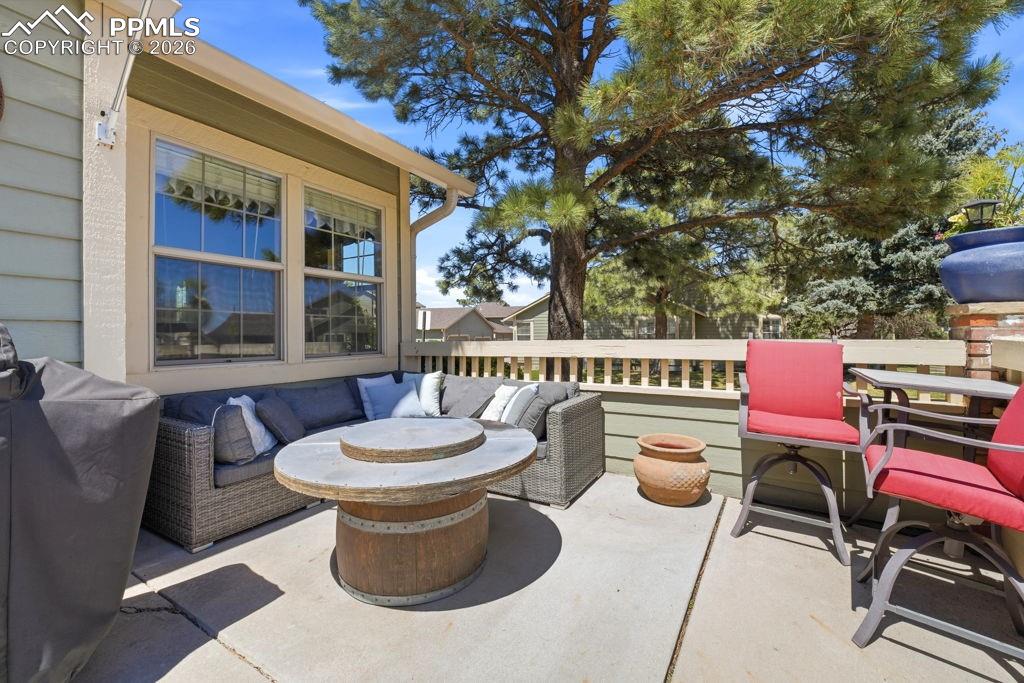 Image 4 of 41: Outdoor patio featuring concrete flooring and a partial privacy fence