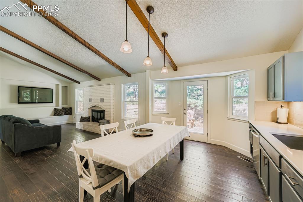 Image 17 of 37: Dining area featuring plenty of natural light, dark wood finished floors, a