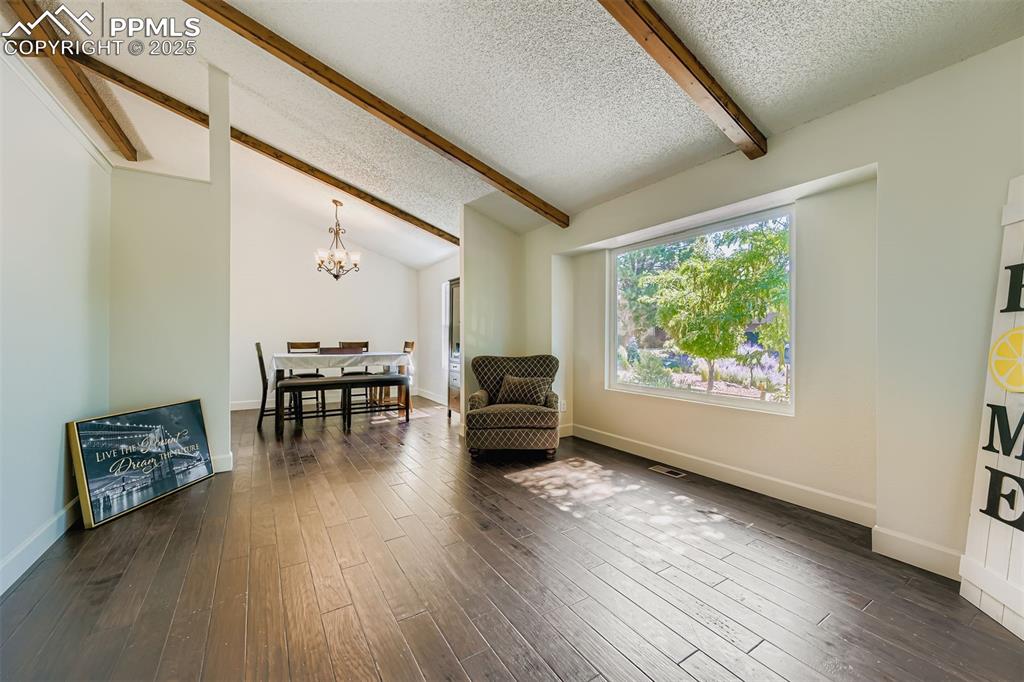 Image 18 of 37: Main Living room to dining room, flexible bright and airy space off foyer!