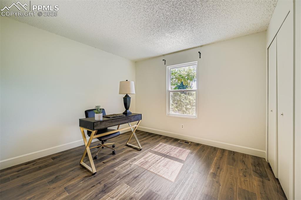 Image 25 of 37: Upper bedroom, set up to be office space!
