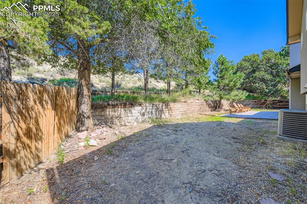 Image 33 of 37: View of yard featuring a patio and privacy!