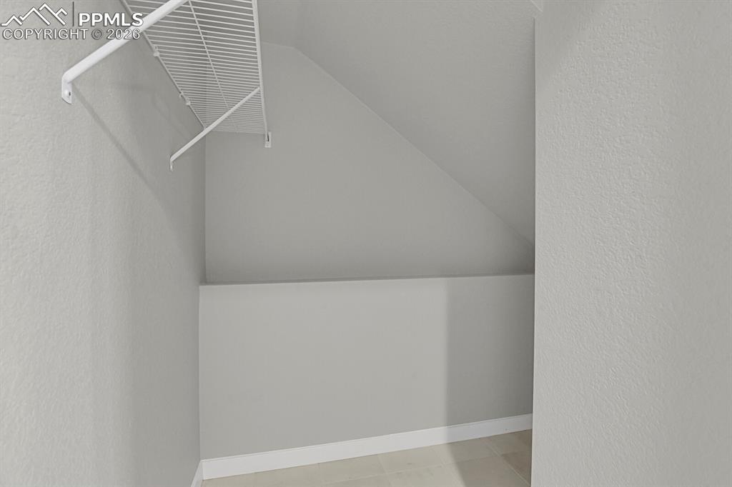 Image 29 of 40: Flex room . storage Spacious closet with lofted ceiling