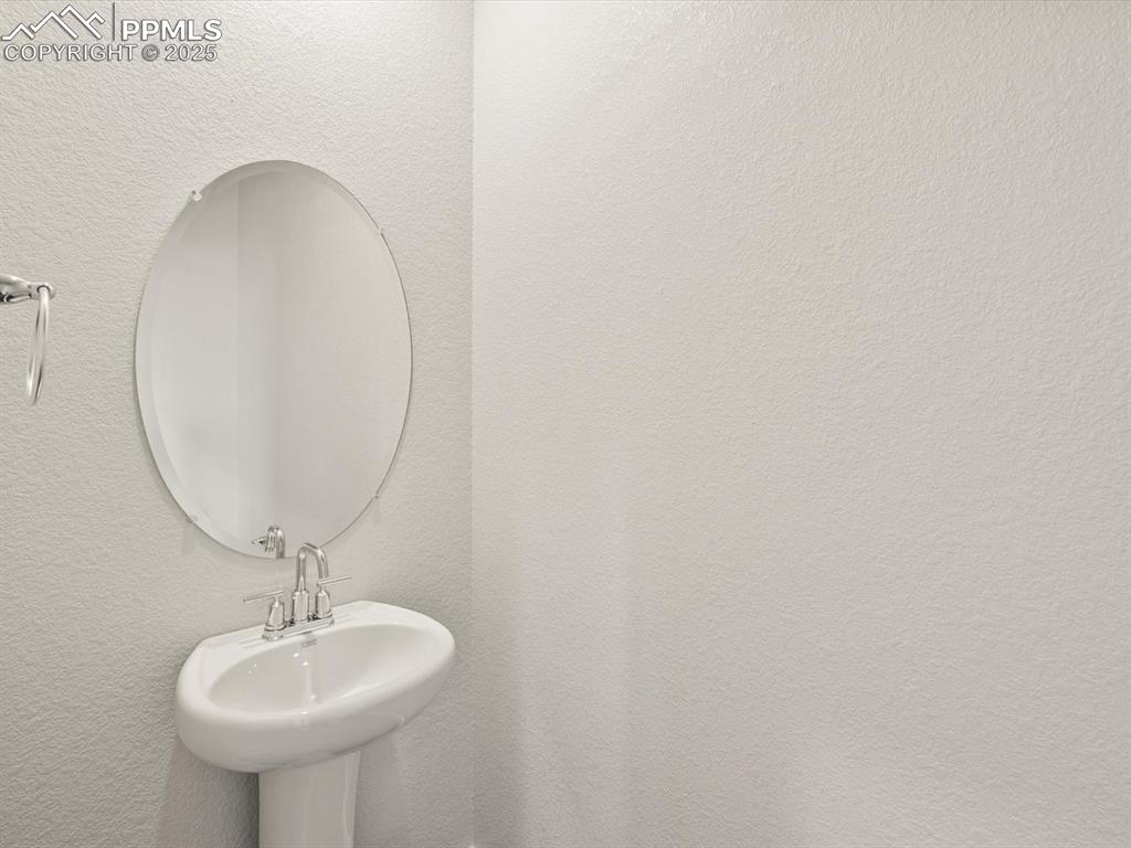Image 10 of 23: Bathroom with a textured wall