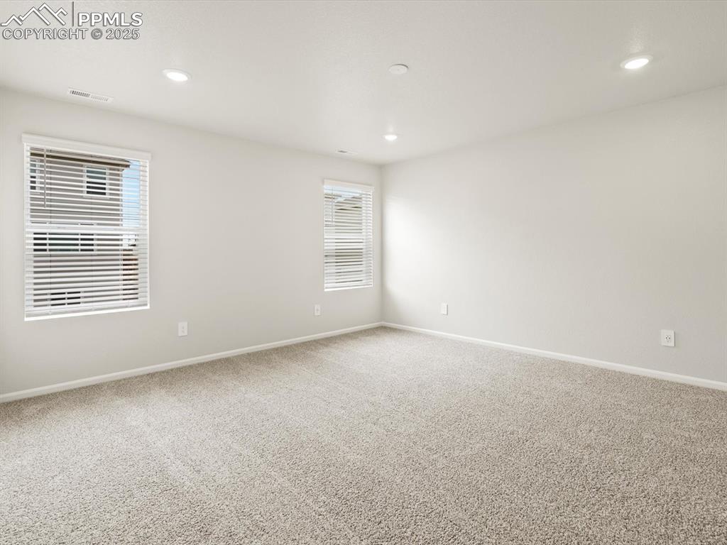 Image 11 of 23: Carpeted empty room featuring recessed lighting and baseboards