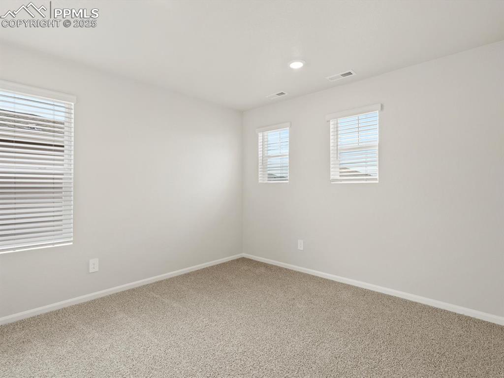 Image 18 of 23: Carpeted empty room featuring baseboards and recessed lighting