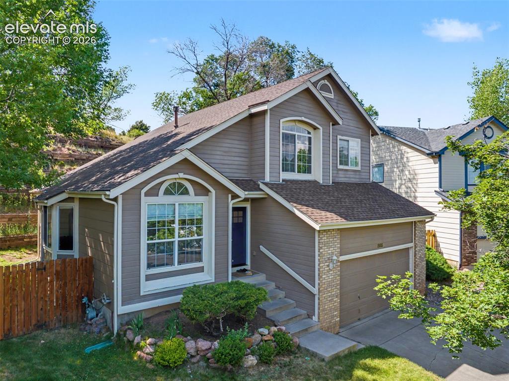 Caption: Beautiful home nestled on a charming street 