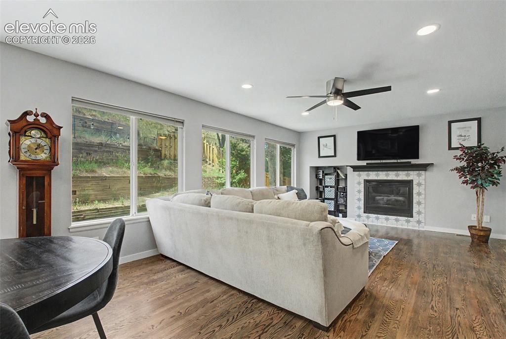 Image 11 of 50: The kitchen leads to the living room and a cozy gas
fireplace