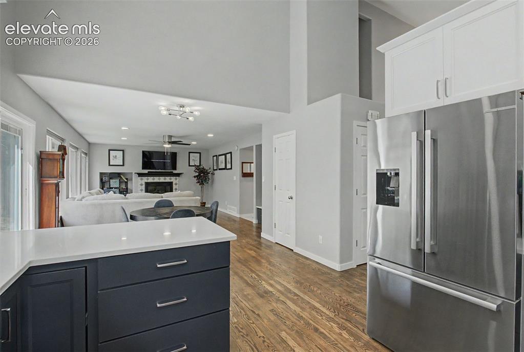Image 15 of 50: Open living area as the kitchen flows into the Living
Room