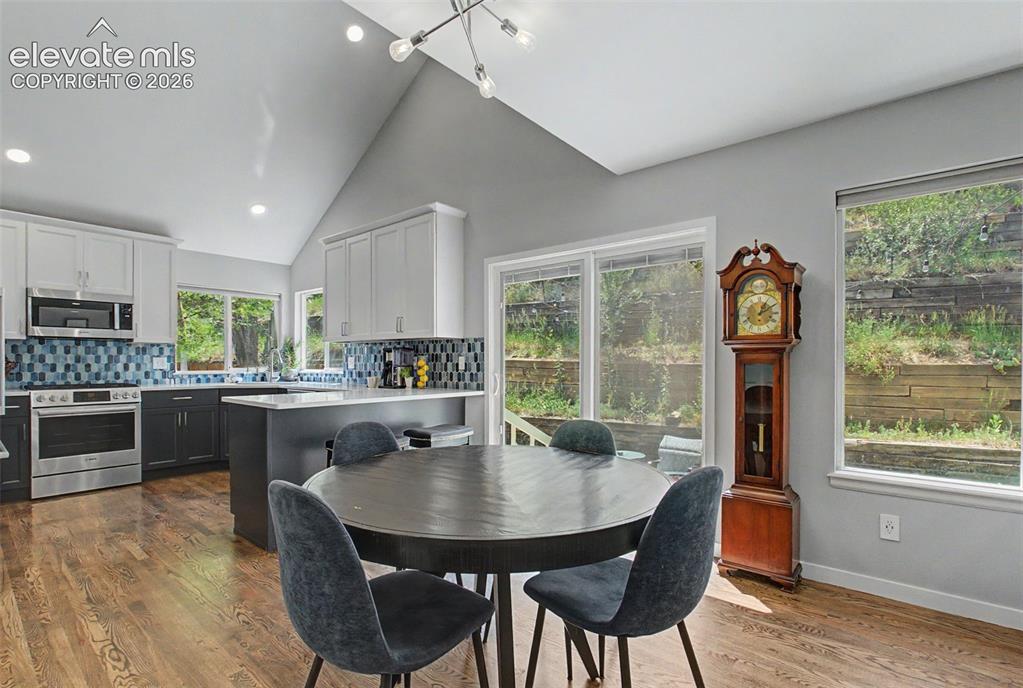 Image 17 of 50: The kitchen opens directly to the private backyard