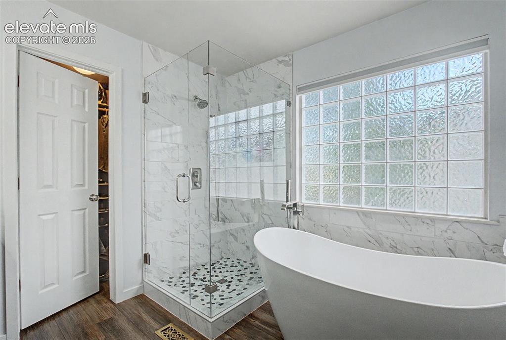 Image 22 of 50: The 5 piece bathroom has been beautiful updated
with a double headed showe