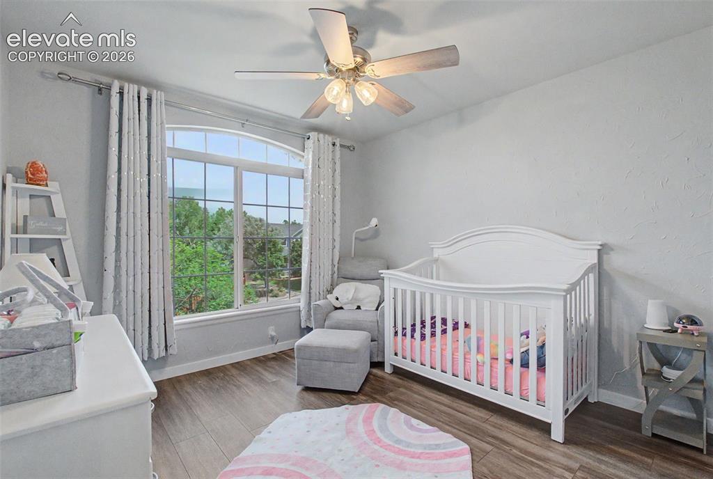 Image 25 of 50: A second bedroom located on the upper level with
large picture window