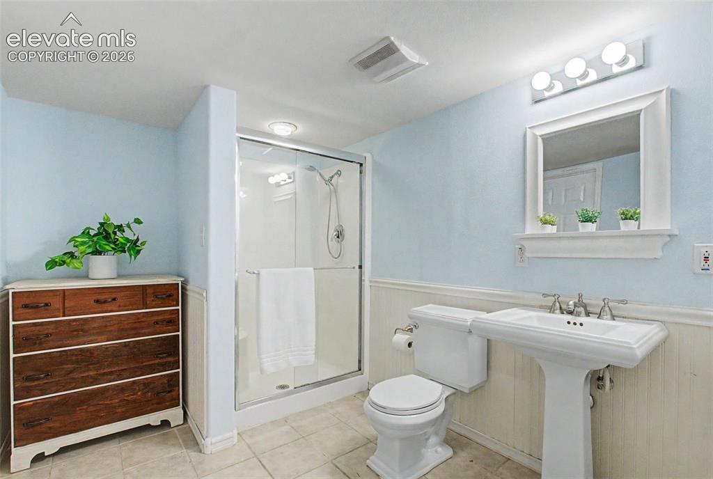 Image 36 of 50: A 3/4 bathroom in the basement is a perfect
ensuite option for guests