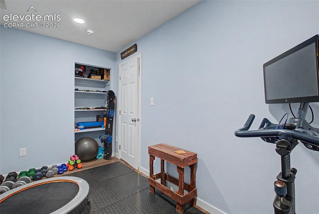 Image 37 of 50: A flexible room in the basement is a perfect home gym