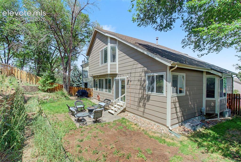 Image 43 of 50: A private backyard with so many options for use