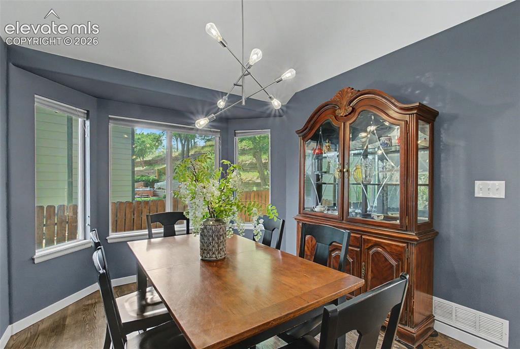 Image 9 of 50: Formal dining room with lovely bay window 